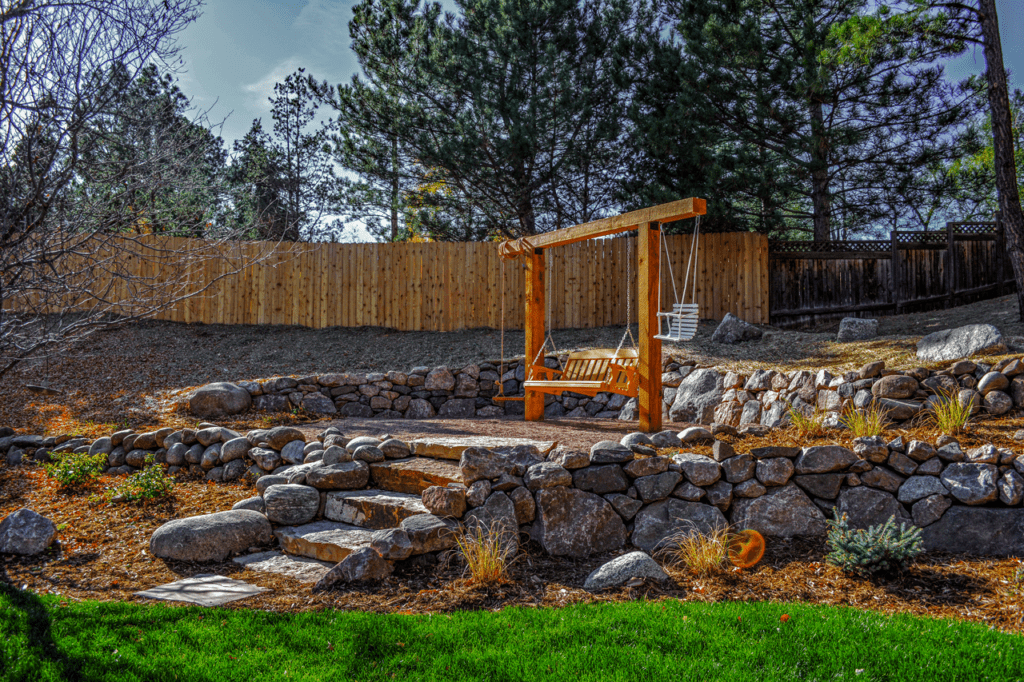 Swing on retaining wall