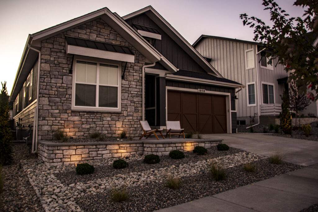 front landscaping with retaining wall night lighting