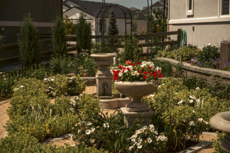 elegant garden with stone pots full of flowers