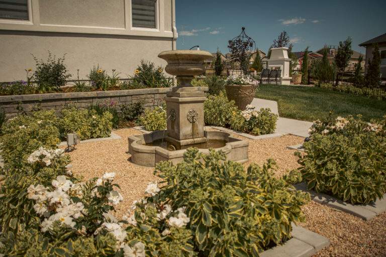 elegant stone water feature in estate style garden