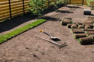 Laying sod for new garden lawn - turf laying