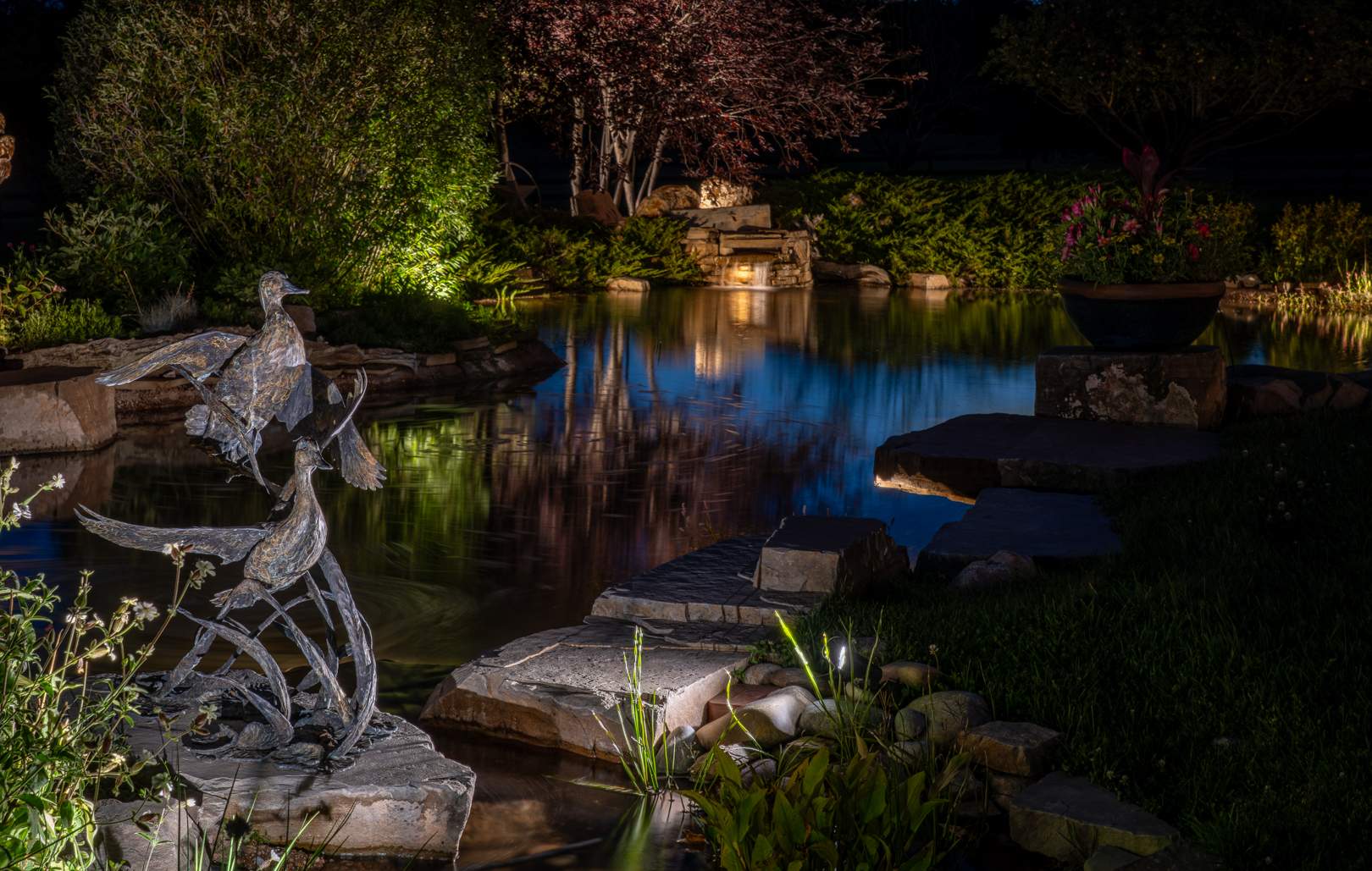 Geese Statue lit up at night