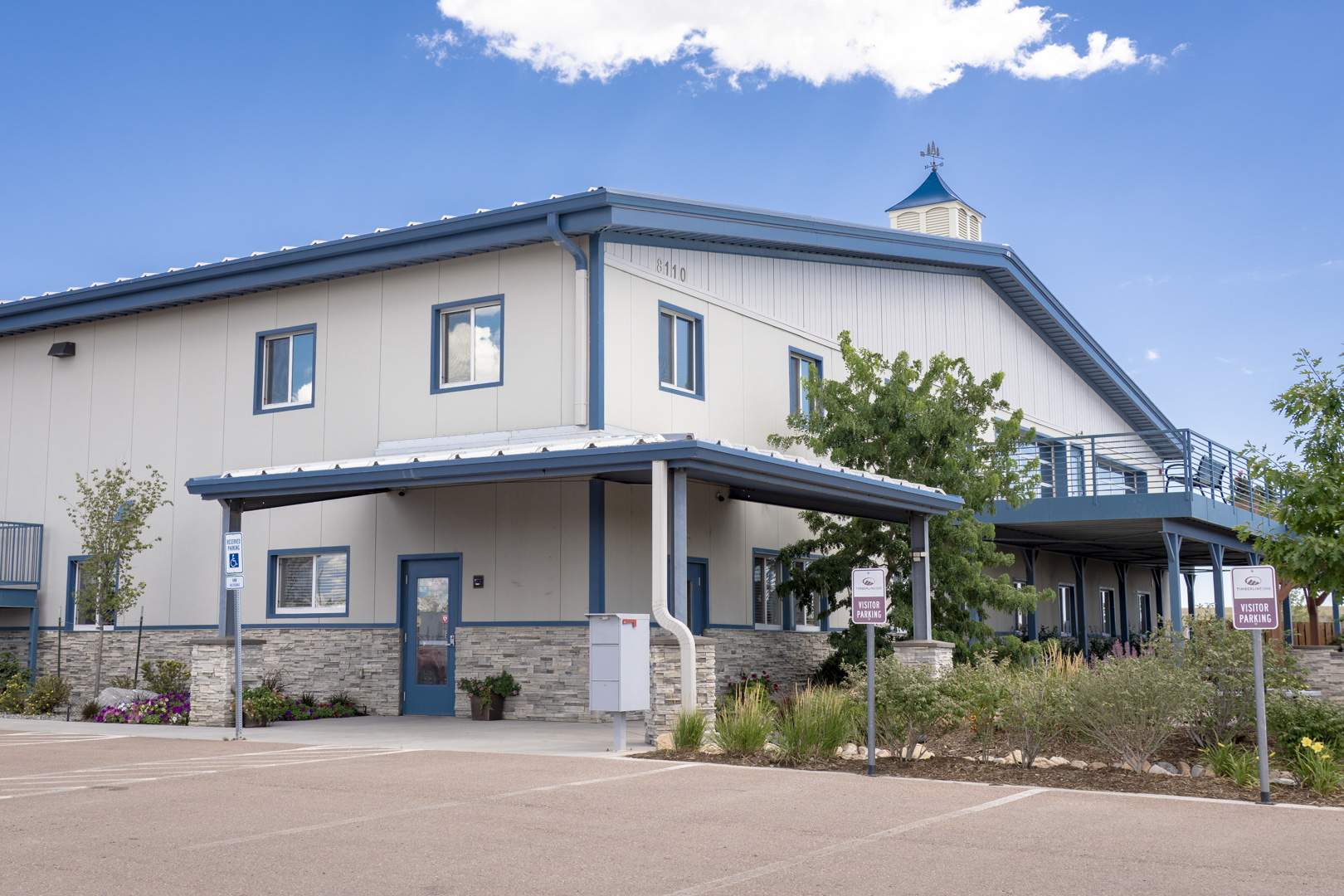 timberline landscaping front office with garden against a blue sky